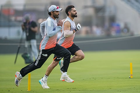 India’s Virat Kohli, back, and Ravindra Jadeja during a practice session ahead of the first ODI cricket match of a series between India and New Zealand, at Kotambi Stadium, in Vadodara, Gujarat.