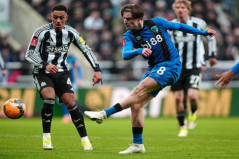 Bournemouth's Alex Scott shoots at goal during the FA Cup third round soccer match between Newcastle United and Bournemouth in Newcastle, England.