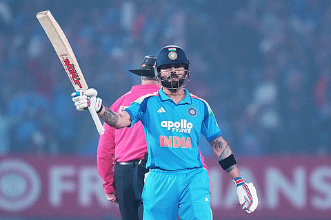 India's Virat Kohli celebrates his fifty runs during the first One Day International cricket match between India and New Zealand in Vadodara, India.