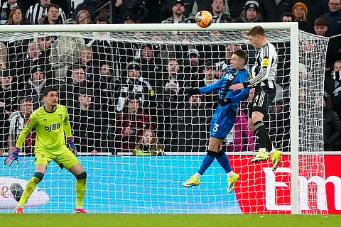 Newcastle United's Harvey Barnes, right, scores their side's third goal of the game in extra time during the FA Cup third round soccer match between Newcastle United and Bournemouth in Newcastle, England.