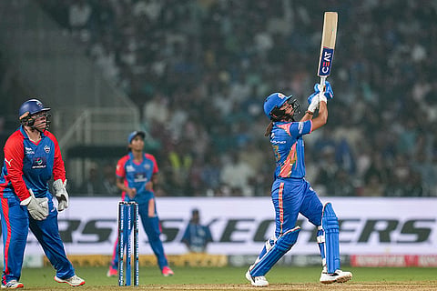 Mumbai Indians' captain Harmanpreet Kaur plays a shot during a Women's Premier League (WPL) T20 cricket match between Mumbai Indians and Delhi Capitals, at the DY Patil Stadium, in Navi Mumbai.