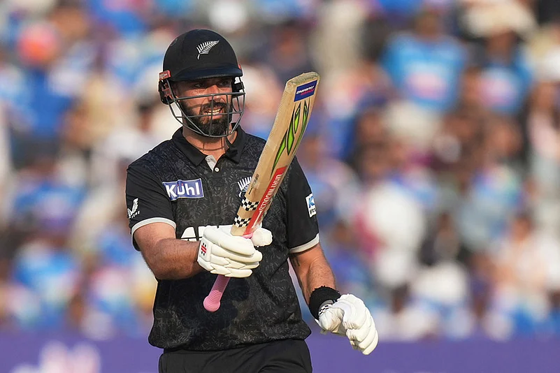 New Zealands Daryl Mitchell celebrates his fifty runs