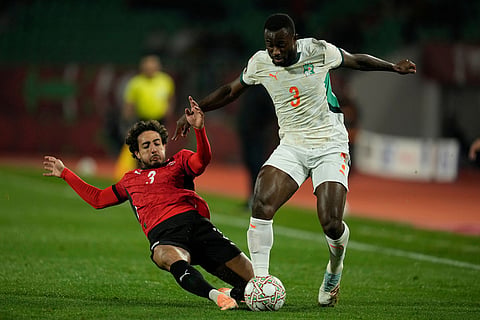 Ivory Coast's Ghislain Konan, right, is challenged by Egypt's Mohamed Hany during the Africa Cup of Nations quarterfinal soccer match between Egypt and Ivory Coast, in Agadir, Morocco.