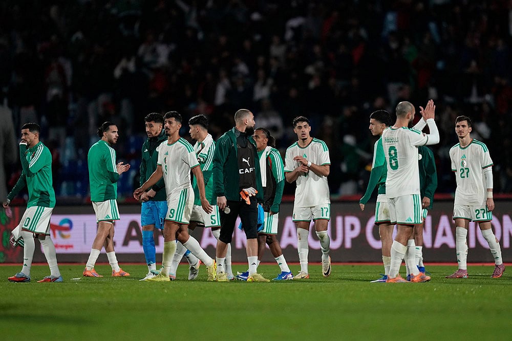 | Photo: AP/Themba Hadebe : Algeria's players leave the field following the Africa Cup of Nations quarterfinal soccer match between Algeria and Nigeria in Marrakech, Morocco.