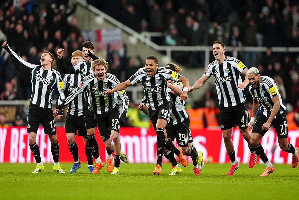 | Photo: Owen Humphreys/PA via AP : Newcastle United players celebrate winning the penalty shoot-out after the FA Cup third round soccer match between Newcastle United and Bournemouth in Newcastle, England.