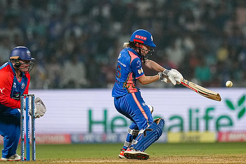 Mumbai Indians' Nicola Carey plays a shot during a Women's Premier League (WPL) T20 cricket match between Mumbai Indians and Delhi Capitals, at the DY Patil Stadium, in Navi Mumbai.