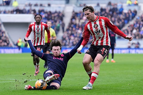 Everton's Nathan Patterson, left, and Sunderland's Dennis Cirkin battle for the ball during the Emirates FA Cup third round match between Everton and Sunderland in Liverpool, England.