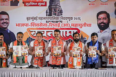 Maharashtra Chief Minister Devendra Fadnavis with state Deputy Chief Minister Ekanth Shinde and others during the launch of Mahayuti's manifesto for BMC elections, in Mumbai.