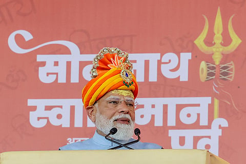 In this image received on Jan. 11, 2026, Prime Minister Narendra Modi addresses a gathering during the Shaurya Yatra procession as part of Somnath Swabhiman Parv, in Somnath, Gujarat.