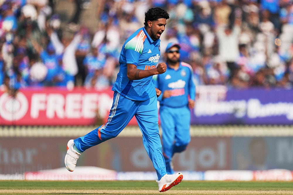 Indias Harshit Rana celebrates the wicket of New Zealands Henry Nicholls 