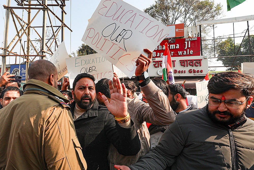 Photo: PTI  : Student wing of the National Conference hold placards during a protest against the withdrawal of the permission letter for Shri Mata Vaishno Devi Medical College, in Jammu.