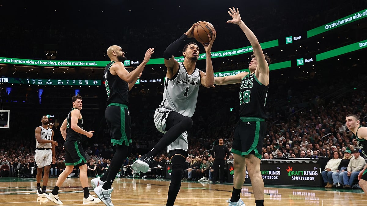 Victor Wembanyama #1 of the San Antonio Spurs drives on Hugo Gonzalez #28 of the Boston Celtics during the second quarter at TD Garden on January 10, 2026 in Boston, Massachusetts.