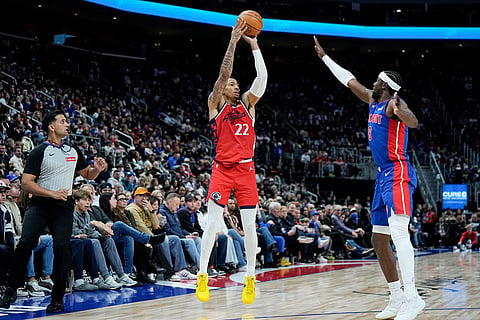 Los Angeles Clippers guard Jordan Miller (22) goes up to shoot against Detroit Pistons guard Caris LeVert, right, during the second half of an NBA basketball game  in Detroit.