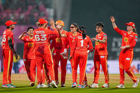 Navi Mumbai: Gujarat Giants' players celebrate the wicket of Delhi Capitals' Chinelle Henry during a Women's Premier League (WPL) T20 cricket match between Gujarat Giants and Delhi Capitals, at the DY Patil Stadium, in Navi Mumbai.