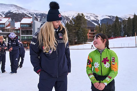 Skier Lindsey Vonn chats with fan Lauren Krip, 9, of Puerto Rico, after members of the U.S. Women's Ski Team took a team photo after practice at Copper Mountain, Colo.