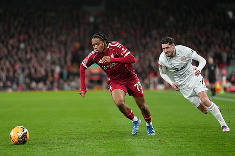Barnsley's Corey O'Keeffe, left, and -mu73- fight for the ball during the FA Cup third round soccer match between Liverpool and Barnsley in Liverpool, England.