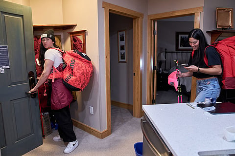 After lunch in the condo they share during training, skiers Jackie Wiles, of Portland, Ore., left, and Bella Wright, of Salt Lake City, leave to meet members of the U.S. Women's Ski Team at Copper Mountain, Colo.