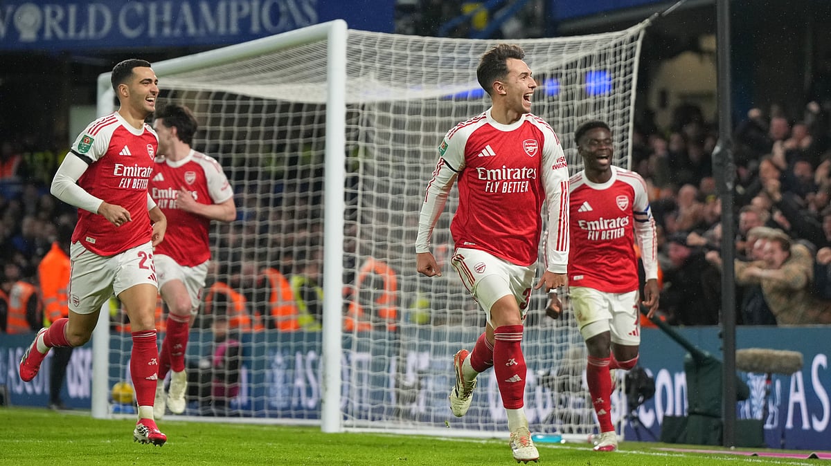 (AP Photo/Alastair Grant) : Arsenal's Martin Zubimendi celebrates after scoring his side's third goal during the English League Cup semifinal first leg soccer match between Chelsea and Arsenal in London, Wednesday, Jan. 14, 2026.