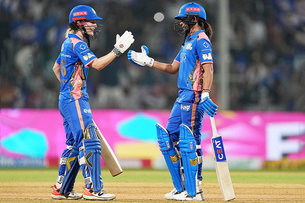 | Photo: PTI/Kunal Patil : Mumbai Indians' captain Harmanpreet Kaur, right, and teammate Nicola Carey celebrate after winning the Women's Premier League (WPL) 2026 T20 cricket match against Gujarat Giants, at the DY Patil Stadium, in Navi Mumbai.