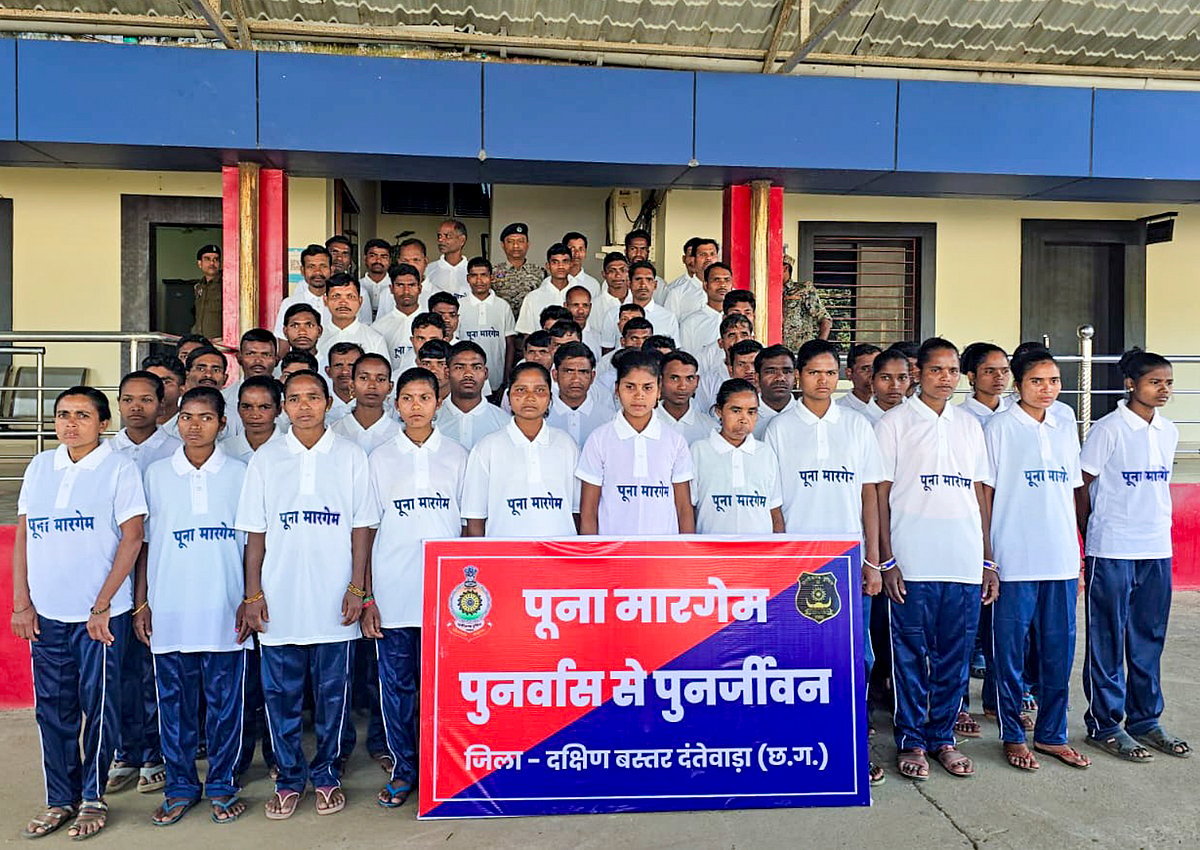 PTI : In this handout image released on Jan. 9, 2026, as many as 63 Naxalites, 36 of them carrying a collective bounty of over Rs 1.19 crore, pose for a group picture after their surrender, in Chhattisgarh's Dantewada district. The cadres, including 18 women, turned themselves in before senior police and Central Reserve Police Force (CRPF) officials, under the 'Poona Margem' initiative.