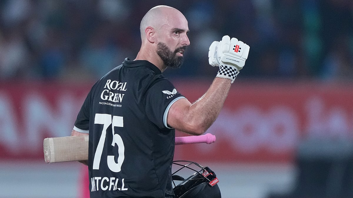 (AP Photo/Ajit Solanki) : New Zealand's Daryl Mitchell celebrates after scoring a century during the second One Day International cricket match between India and New Zealand in Rajkot, India, Wednesday, Jan. 14, 2026