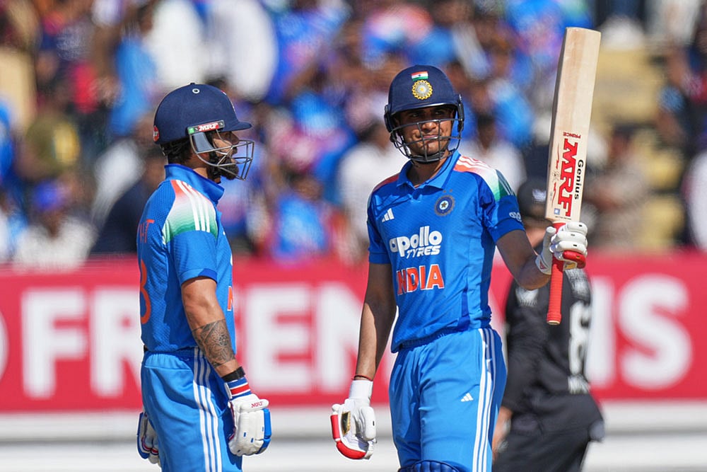 Indias captain Shubman Gill celebrates after scoring fifty runs