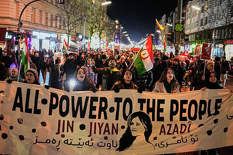 Protesters participate in a demonstration in support of the nationwide mass protests in Iran against the government, in Berlin, Germany.