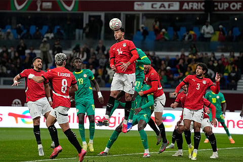 Egypt's Hamdy Fathy heads the ball during the Africa Cup of Nations semifinal soccer match between Senegal and Egypt, in Tangier, Morocco.