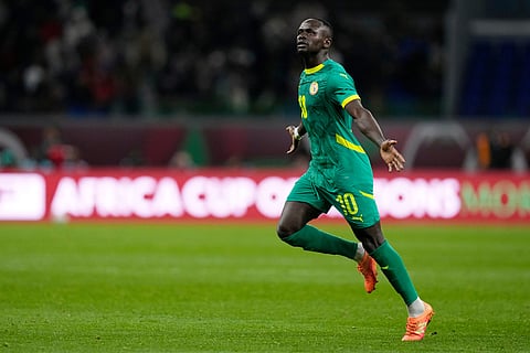 Senegal's Sadio Mane celebrates after scoring his side's opening goal during the Africa Cup of Nations semifinal soccer match between Senegal and Egypt, in Tangier, Morocco.