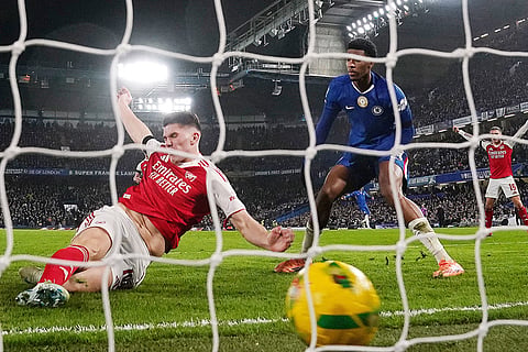 Arsenal's Viktor Gyokeres, left, scores their side's second goal during the English League Cup semifinal first leg soccer match between Chelsea and Arsenal in London.