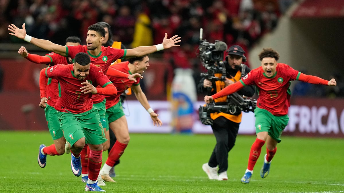 (AP Photo/Mosa'ab Elshamy) : Morocco players celebrate after winning after a penalty shootout during the Africa Cup of Nations semi-final match between Nigeria and Morocco in Rabat, Morocco, Wednesday, Jan. 14, 2026. 