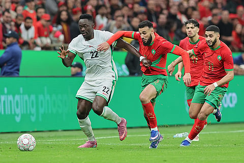 Nigeria's Akor Adams, left, and Morocco's Noussair Mazraoui fight for the ball during the Africa Cup of Nations semi-final match between Nigeria and Morocco in Rabat, Morocco.