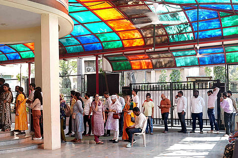 Voters line up in queue for civic elections