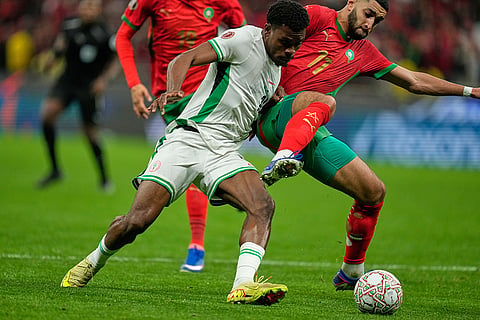 Nigeria's Fisayo Dele-Bashiru, left, and Morocco's Ismael Saibari fight for the ball during the Africa Cup of Nations semi-final match between Nigeria and Morocco in Rabat, Morocco.