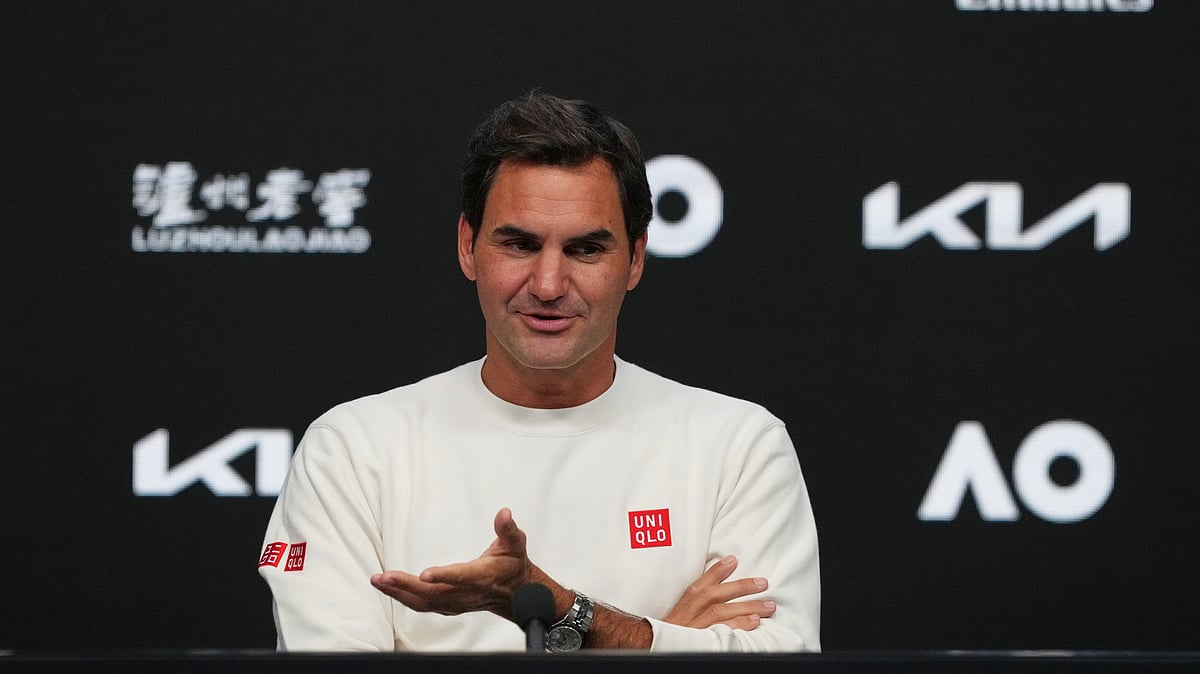 (AP Photo/Mark Baker) : Roger Federer of Switzerland gestures during a press conference ahead of the Australian Open tennis championship in Melbourne, Australia, Thursday, Jan. 15, 2026