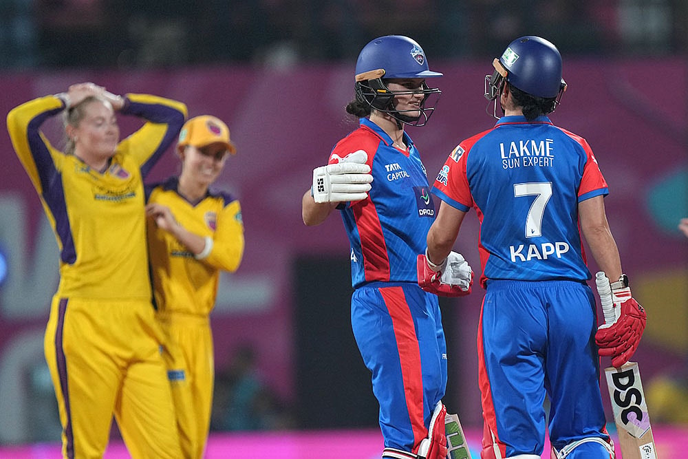 | Photo: PTI/Kunal Patil : Delhi Capitals' Laura Wolvaardt and Marizanne Kapp wait for third umpire's decision regarding the latter's wicket after a review by UP Warriorz during the Women's Premier League (WPL) 2026 T20 cricket match between UP Warriorz and Delhi Capitals, at the DY Patil Stadium, in Navi Mumbai.