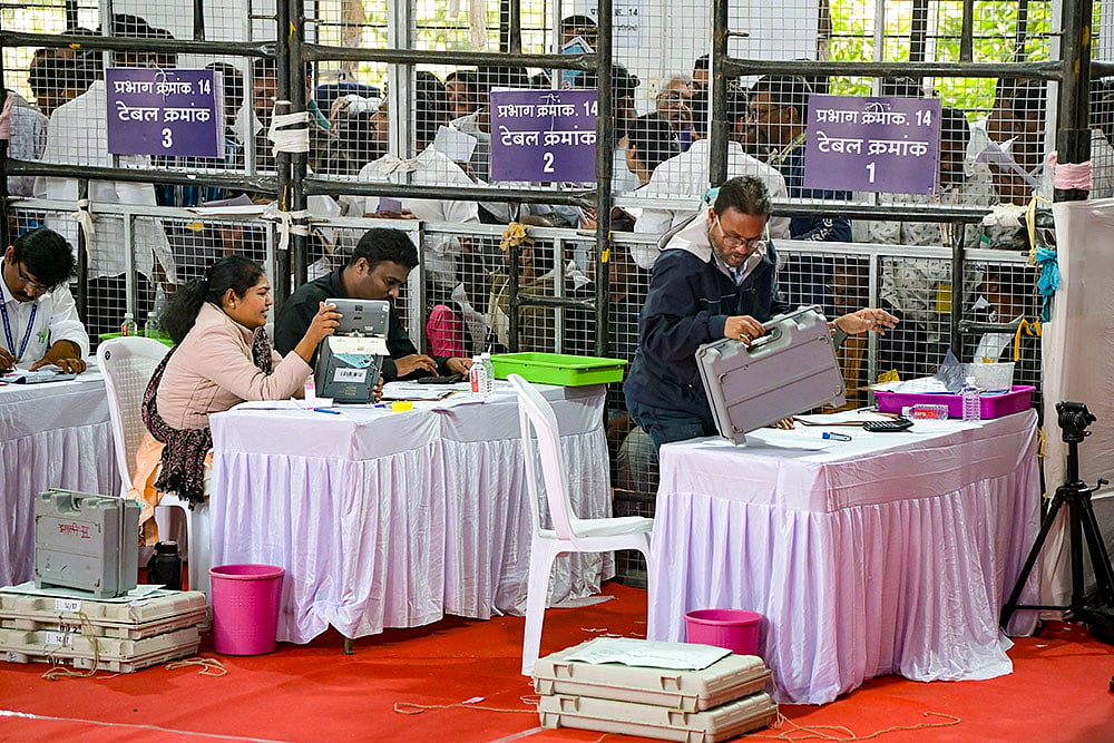 | Photo: PTI : Polling officials during counting of votes for the Nagpur Municipal Corporation election, at a centre in Nagpur, Maharashtra.
