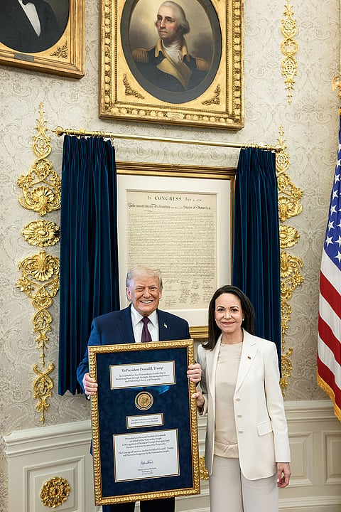 Venezuelan opposition leader María Corina Machado presents her Nobel Peace Prize to US President Donald Trump during a meeting at the Oval Office, in Washington, DC. Machado, who has on previous occasions said that she would give her Nobel prize to Trump, met the American President in the White House Thursday, a closely-watched meeting that came days after the US carried out a military strike in Venezuela and captured its leader Nicolás Maduro. 