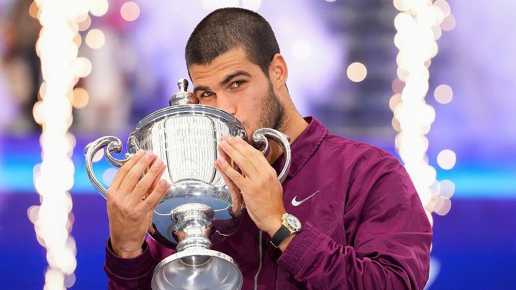 File/AP : Carlos Alcaraz kisses the championship trophy after defeating Jannik Sinner, of Italy, in the men's singles final of the U.S. Open tennis championships.
