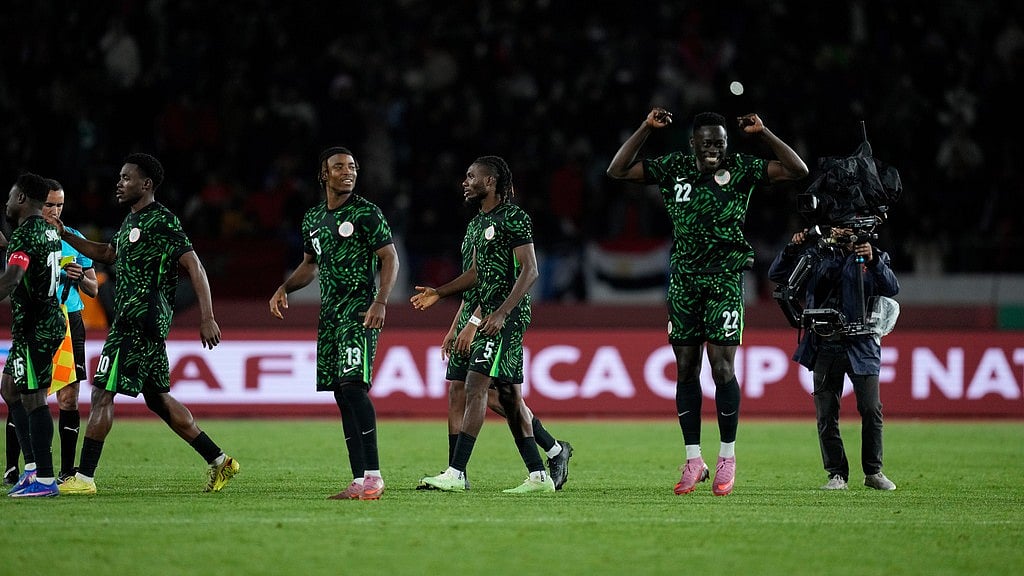Photo: AP : Nigeria national team react after winning on penalties during the Africa Cup of Nations third place game between Egypt and Nigeria in Casablanca, Morocco.