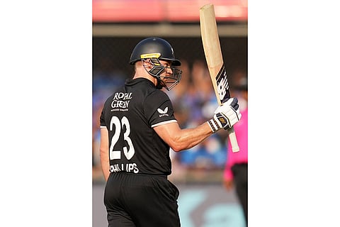 New Zealand's Glenn Phillips celebrates his fifty runs during the third One Day International cricket match between India and New Zealand in Indore, India.