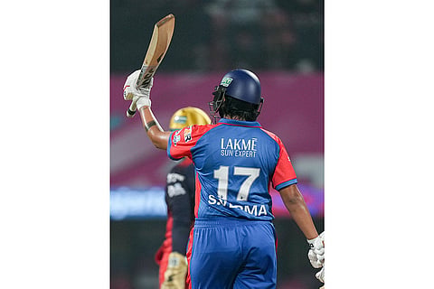 Delhi Capitals' Shafali Verma celebrates her half-century during the Women's Premier League (WPL) T20 cricket match between Royal Challengers Bengaluru and Delhi Capitals, at the DY Patil Stadium, in Navi Mumbai.