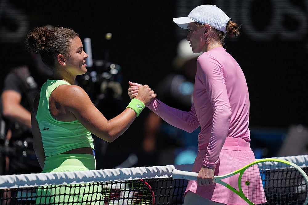Jasmine Paolini, left, of Italy is congratulated by Aliaksandra Sasnovich