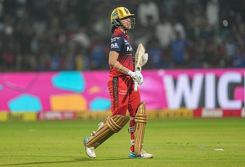 Royal Challengers Bengaluru's captain Smriti Mandhana walks off the field after her dismissal during the Women's Premier League (WPL) T20 cricket match between Royal Challengers Bengaluru and Delhi Capitals, at the DY Patil Stadium, in Navi Mumbai.