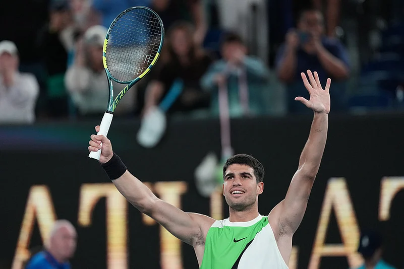 Carlos Alcaraz of Spain celebrates after defeating Adam Walton of Australia