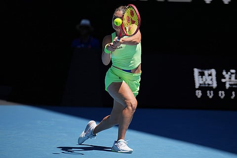 Jasmine Paolini of Italy plays a backhand return to Aliaksandra Sasnovich of Belarus during their first round match at the Australian Open tennis championship in Melbourne, Australia.