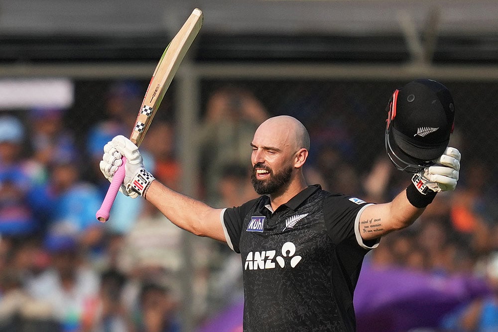 New Zealands Daryl Mitchell celebrates his century