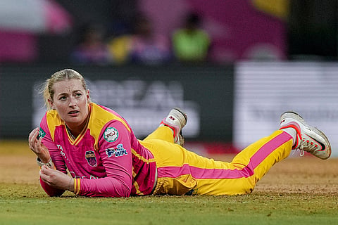 UP Warriorz's Sophie Ecclestone during the Women's Premier League (WPL) T20 cricket match between Mumbai Indians and UP Warriorz, at the DY Patil Stadium, in Navi Mumbai.