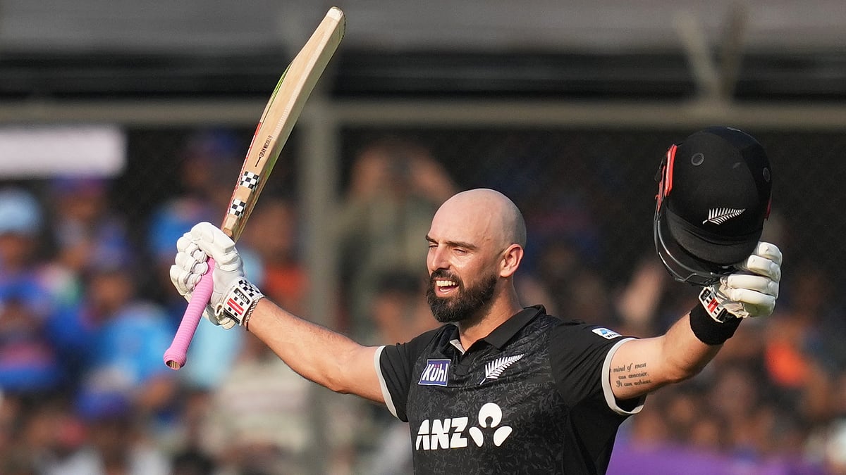 (AP Photo/Rafiq Maqbool) : New Zealand's Daryl Mitchell celebrates his century during the third One Day International cricket match between India and New Zealand in Indore, India, Sunday, Jan. 18, 2026
