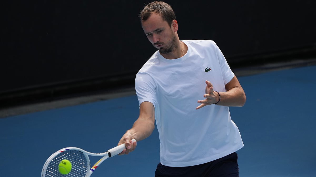 AP Photo/Dita Alangkara : Daniil Medvedev of Russia plays a forehand return to during a practice session ahead of the Australian Open tennis championship in Melbourne, Australia, Friday, Jan. 16, 2026. 